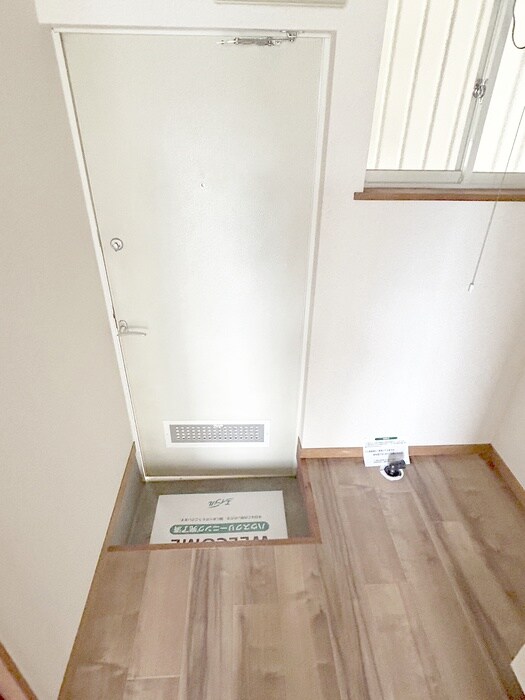 ホワイトコ－トの玄関