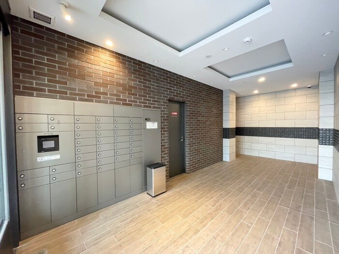 ｴｽﾃﾑｺｰﾄ神戸山手ｽﾃｰｼｮﾝﾃﾞｭｵのエントランス部分