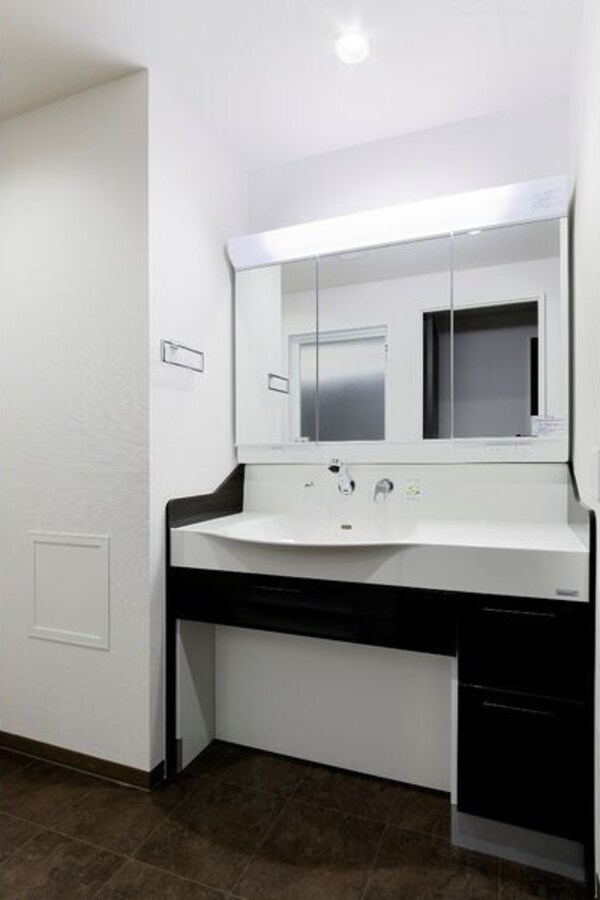 洗面・脱衣所(※写真は同じマンションの違う部屋のものになります。)